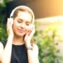 woman meditating with headphones on