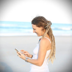 Photo of Emma on beach working